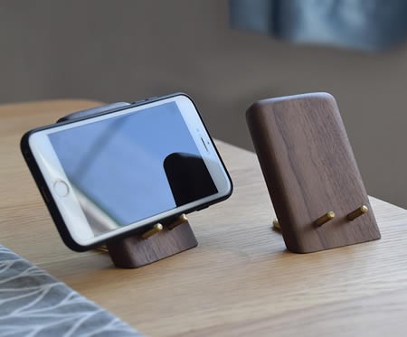 Classic black walnut combined with brass cell phone holder