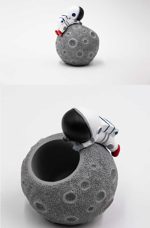 Cute cartoon astronaut with moon office desktop pen holder